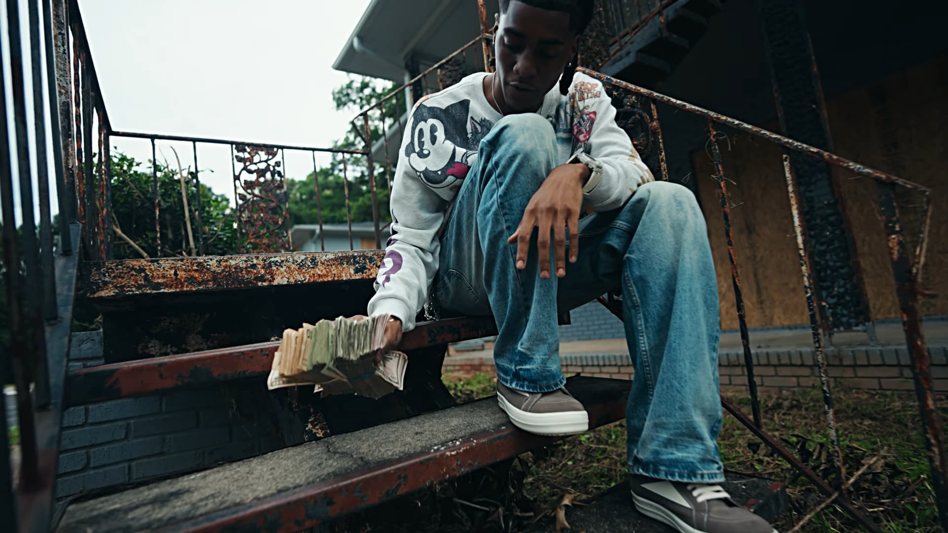 RW 5ive seated on outdoor stairs